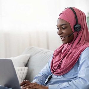 Woman sitting on the couch at home answering phone calls