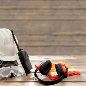 Variety of construction site safety equipment sitting on a bench