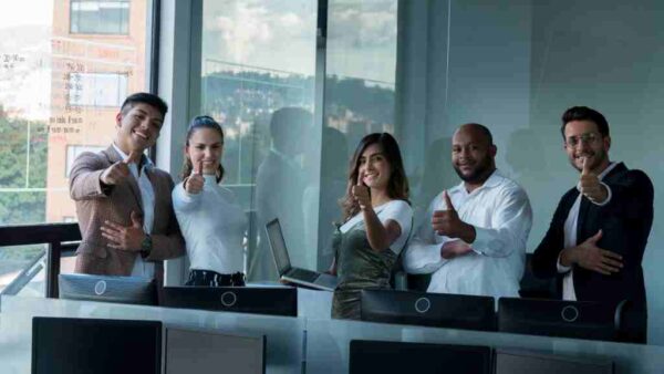 Image depicting employees showing thumbs-up